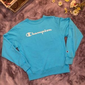 A light blue Champion crew neck